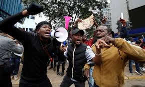 A group of young Kenyan Youth holding placards during a peaceful protest in Nairobi