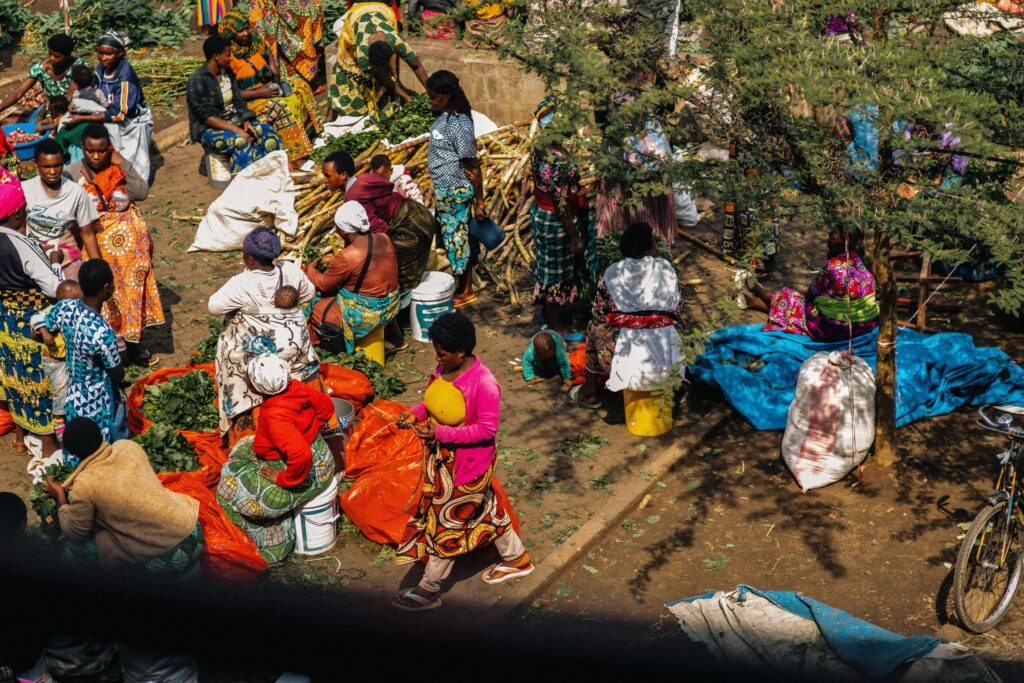 Kenyan open market with traders selling goods like food,